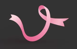 breast cancer awareness ribbon on a dark background